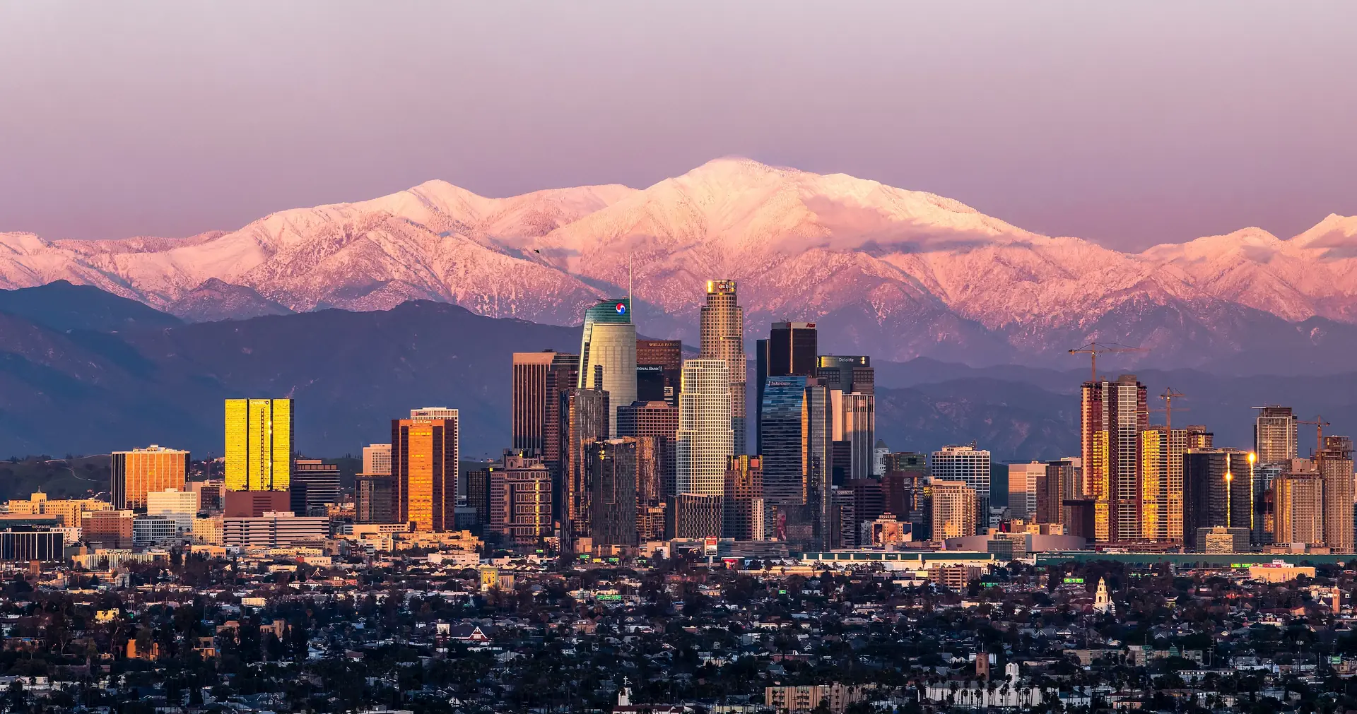 Downtown Los Angeles with Mount Baldy behind it